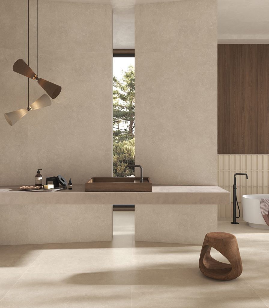 Limestone effect tiles used in a commercial bathroom setting.